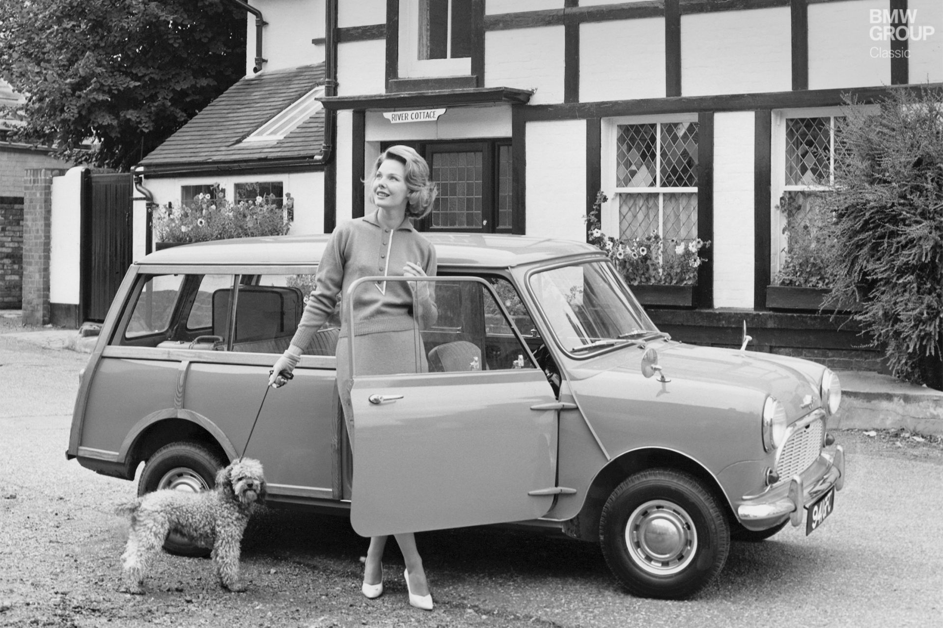 Woman with dog in front of Mini Classic